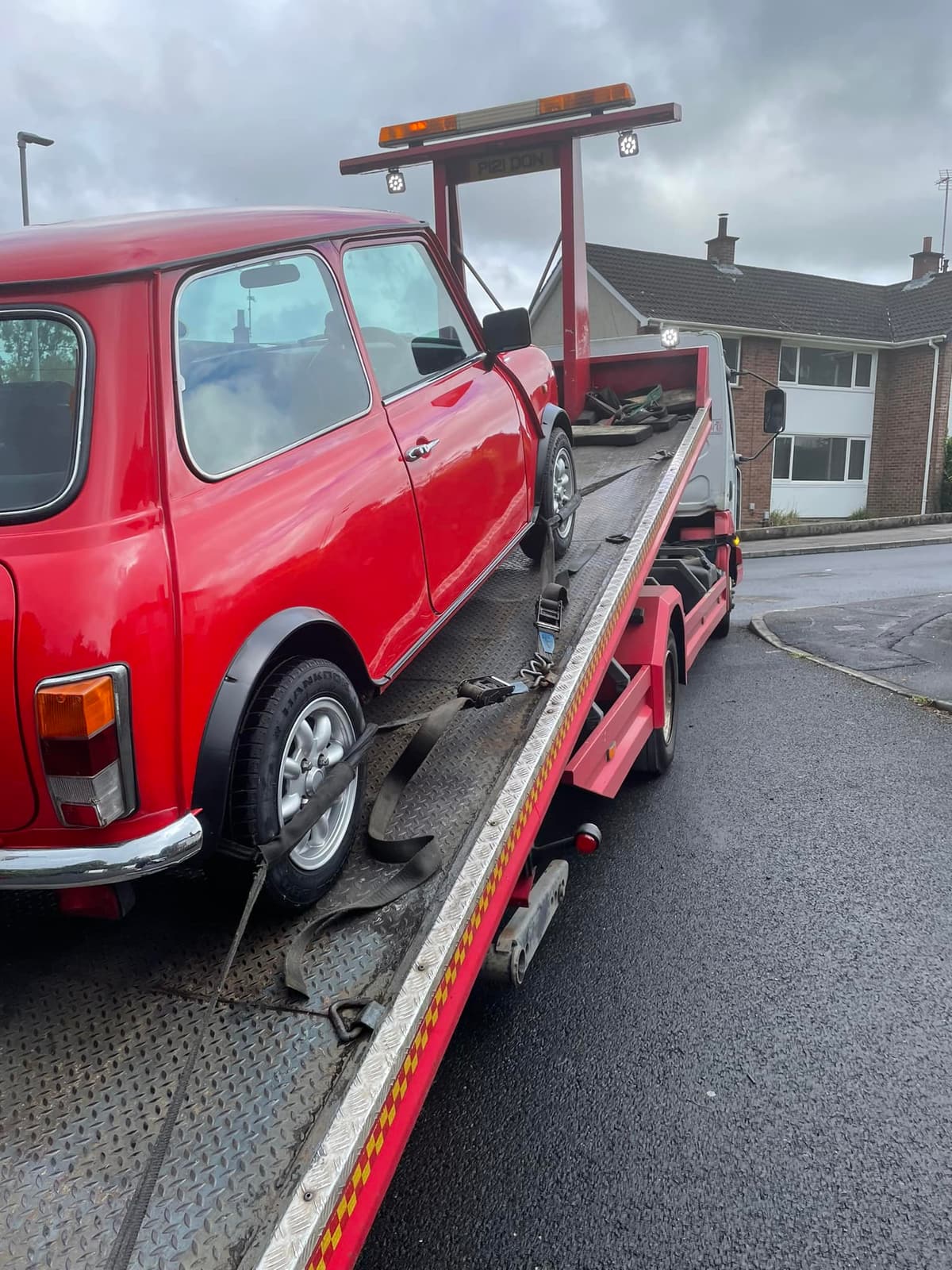 Retro Mini Cooper on recovery truck